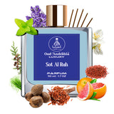Oud Andriabia luxury parfum bottle with floral and spice elements on a white background